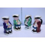 Four assorted large character jugs including Burlington examples