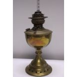 A vintage brass oil lamp base by Vertas. Shipping unavailable