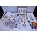 A selection of stamp albums and loose stamps