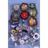 A job lot of assorted enamel badges, badges and cloth patches