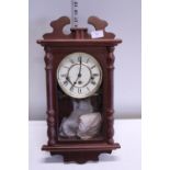 A working Vienna style wall clock with key and pendulum, shipping unavailable