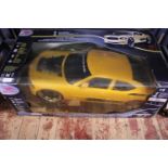 A large boxed remote control car 1/6 scale with remote in working order, shipping unavailable