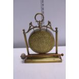 A brass table dinner gong