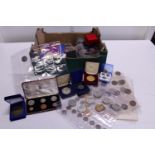 A job lot of assorted coin sets and commemorative coins