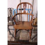 A child's Windsor armchair, missing central splat, shipping unavailable