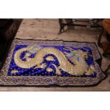 A elaborately embroidered wall tapestry with Dragon decoration
