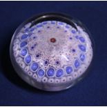 A circa 1850 Bacchus paperweight with millefiori decoration, blue canes with a central red cane