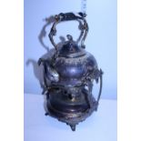 A antique silver plated spirit kettle with burner