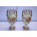 A pair of early Edwardian Japonica handled urns