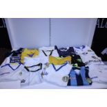 A selection of retro Leeds United Football shirts etc