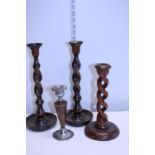 A pair of Victorian wooden candlesticks and two other