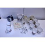 A job lot of assorted commemorative ware mugs and other