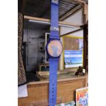 A large Swatch shop display watch (some fading due to sun, strap has wear, works), shipping