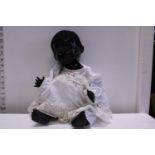 A vintage Pedigree doll with growler