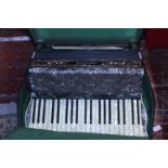 A vintage cased Hohner Tango 3 accordion in good condition. Shipping unavailable