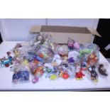 A box full of assorted Mc Donald's collectable toys including full sets