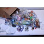 A bag full of sealed Burger King collectors toys