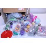 A box full of assorted McDonald's collectors toys