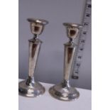 A pair of hallmarked for London silver candlesticks (loaded) total weight 508g
