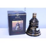 A sealed bottle of commemorative Bell's Whisky dated 1992 75cl