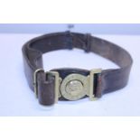 A Victorian Boer war era military leather belt with brass buckle