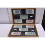 A selection of framed vintage British Banknotes. Shipping unavailable