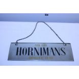 A vintage glass wall hanging plaque for Hornimans quality tea