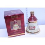 A sealed bottle of commemorative Bell's Whisky dated Christmas 1996 70cl
