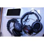 A boxed smartphone and two sets of headphones, (untested)
