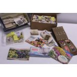 A job lot of assorted loose collectors cards and albums