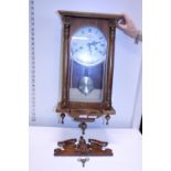 A vintage wooden cased Vienna style wall clock, shipping unavailable