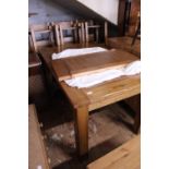 A quality solid oak table and a set of six chairs. Table measures 180cm long (fully extended) 90cm