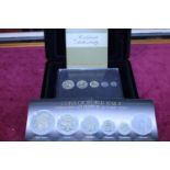 A cased set of five silver commemorative coins with 22ct gold plate decoration. (WW2 commemorative