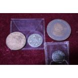 A selection of antique coins including a 1828 American one cent coin. George III 1787 silver