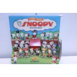 A Snoopy McDonalds Happy Meal display with figures