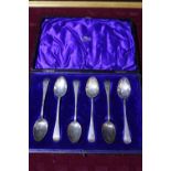 A cased set of hallmarked silver & gilt tea spoons