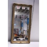 A vintage gilt framed mirror 67cm x 33cm. Shipping unavailable.