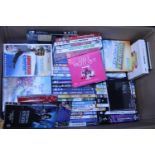 A box full of assorted DVD's and CD's