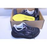 A pair of New Gdefy training shoes size USA 8.5