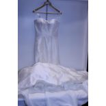 A ladies Justin Alexander wedding dress size 6