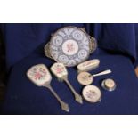 A vintage dressing table set with needle point decoration