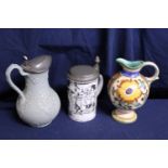 Three assorted antique jugs & tankards