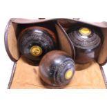 A set of vintage lawn bowls made in Penshurst, Kent.