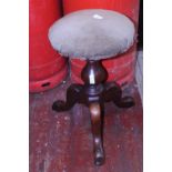 A Victorian adjustable piano stool. Postage unavailable