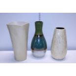 Three assorted ceramic vases. Postage unavailable