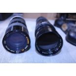 Two 35mm telephoto camera lenses. Soligor & Mitakon