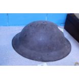 A WW2 period British tin helmet