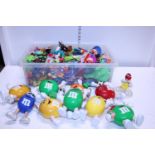 A selection of assorted M&M's promotional and advertising toys