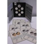 A Their Finest Hour Battle of Britain commemorative coin set. The central coin is in 9ct gold and