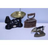 A vintage set of scales & weights and two vintage irons. postage unavailable